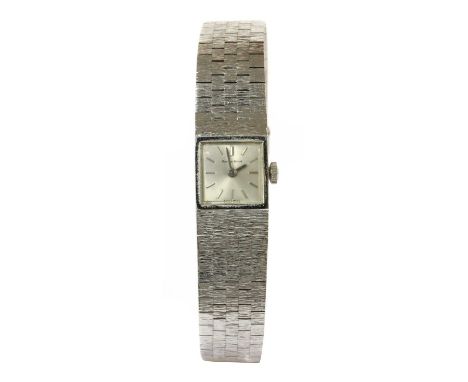 A ladies' 9ct white gold Bueche Girod mechanical bracelet watch, c.1970, a square case, 14.7mm diameter, with a silvered dial