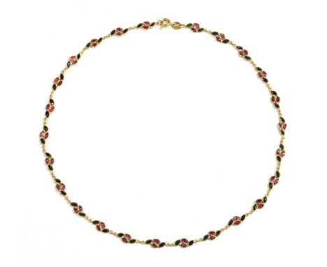 A gold ruby and sapphire necklace, articulated links of two marquise cut rubies and two marquise cut sapphires, spectacle set