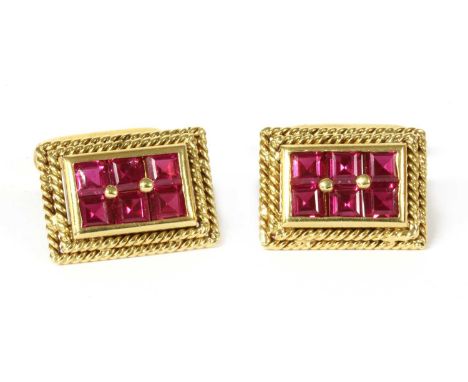 A pair of gold synthetic ruby cufflinks, rectangular faces, with square step cut synthetic rubies, rub and peg set, with step