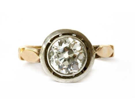 A gold single stone diamond ring, an old European cut diamond, with an estimated weight of approximately 1.75ct, rub set in w