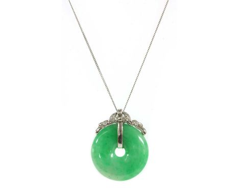 A white gold jadeite jade bi and diamond pendant,the jadeite jade bi disc with a white gold garland surmount, grain set with 