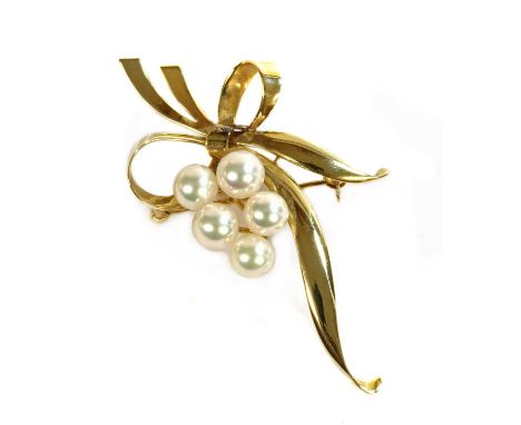 A gold cultured pearl spray brooch by Mikimoto,a cluster of cultured pearls, 6.9 to 6.3mm in size, peg set to polished gold r