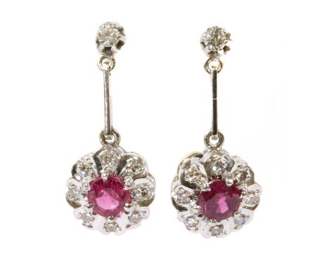 A pair of 18ct gold ruby and diamond drop earrings, a circular mixed cut ruby, claw set, to surround of grain set eight cut d