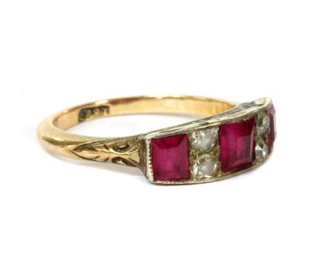 A gold and silver, synthetic ruby and diamond ring, a graduated row of square step cut synthetic rubies, with pairs of old br