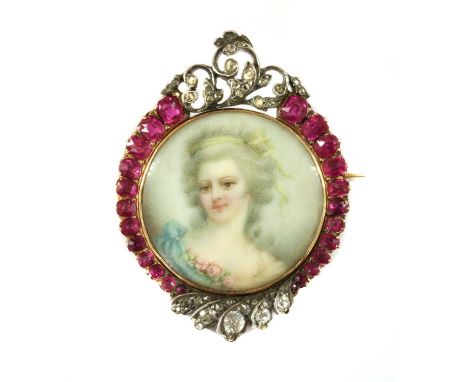 A gold ruby and diamond set miniature portrait brooch, a circular portrait miniature with glazed panel, to frame of graduated