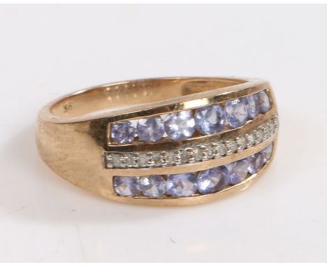 A 9 carat gold diamond ring, the head set with row of diamonds and two rows of light blue glass stones either side, ring size