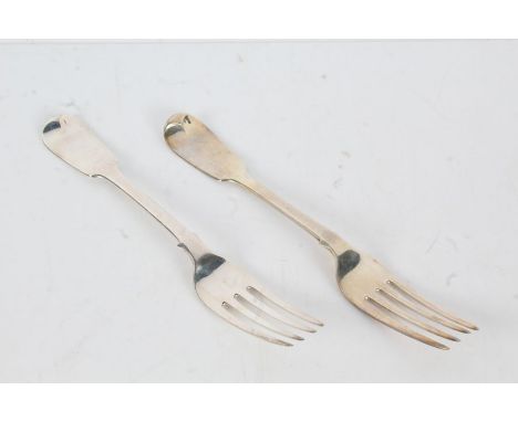 Two William IV silver table forks, the first London 1830, maker William Theobolds, the fiddle patter handle initialled K, the