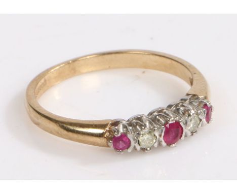 A 9 carat gold, ruby and diamond ring, the head set with three rubies intersected by two diamonds, ring size O weight 2.1 gra