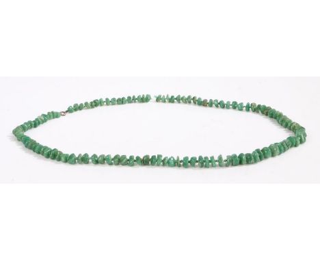 A graduated jade necklace with individually knotted pebble shaped beads.Approx. length 84cm.Weighing 120 grams.Used, in good 