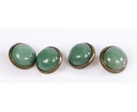 A set of four round yellow metal buttons with jade cabochons.Approx. diameter of cabochon 12mm.Gross weight 7.6 grams.
