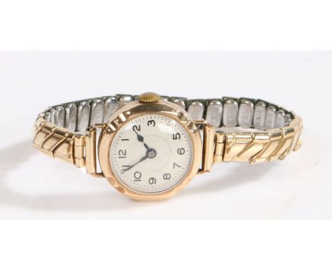 Ladies 9 carat gold wristwatch, the cream dial with Arabic markers and outer minutes track, manual wound, the case 21.5mm dia