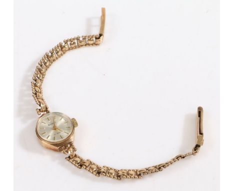 Accurist 9 carat gold ladies wristwatch, the signed silver dial with baton markers, manual wound, the case 15mm wide, on a 9 