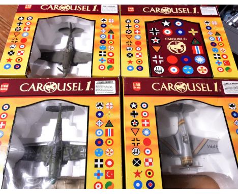 4 Carousel 1 1:48 scale aircraft. 2x Focke-Wulf 190D 'Dora-11' and a 'Dora -13'. A P-40B 'Pearl Harbor'. Plus a P-36A Hawk, '