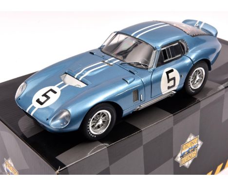 An Exoto Racing Legends 1:18 scale Cobra Daytona Coupe. In light metallic blue, RN5. Boxed, minor crushing to one corner. Veh