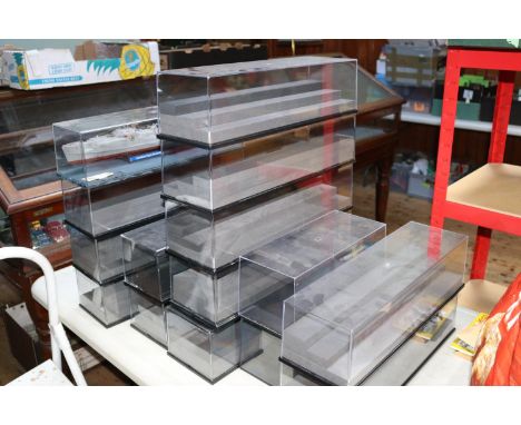 15 plastic display cases ideal for displaying 1:43 and 1:18 scale vehicles. Overall length 50cm, depth 15cm, height 13cm. 11 