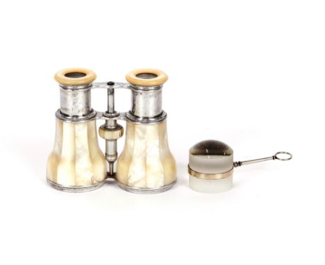 A pair of mother of pearl and polished metal cased French binoculars; and a 19th Century glass magnifier with white metal loo