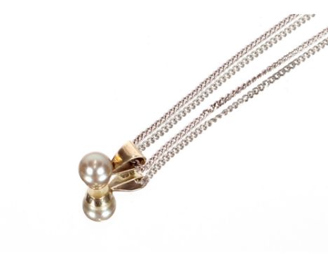 A 9ct white gold and pearl set pendant, hung to an 18ct white gold chain