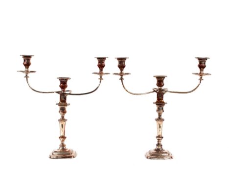 A pair of 19th Century plate on copper three light candelabra, having gadroon border decoration