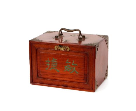 A hardwood and brass cased Mah Jong set having bone and bamboo tiles, complete with four light oak Winds