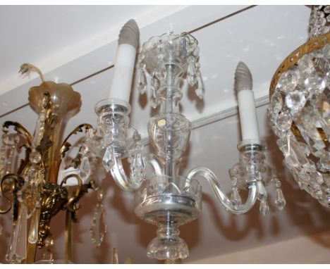 A glass and prism drop three branch light fitting