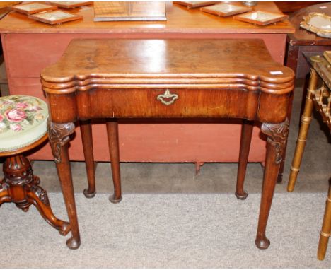 A George III mahogany triple fold over tea / card table, with inlaid chequerboard interior and lifting compartment for chess 