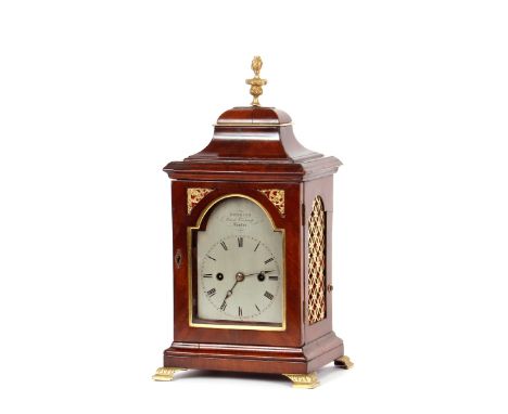 A George III mahogany cased bracket clock, by Hoskins Royal Exchange, London, the case surmounted by an urn finial with brass