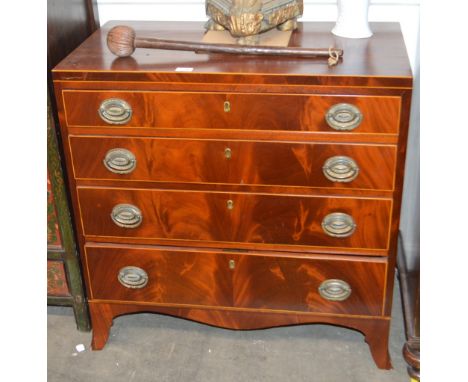 A Georgian mahogany and box wood strung chest, of four long graduated drawers raised on a shaped apron and bracket feet, 82cm