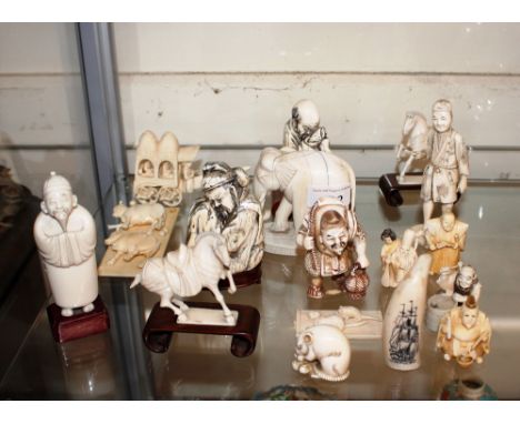 A collection of antique Oriental carved ivory figures including Netsuke, and some later resin examples&nbsp;