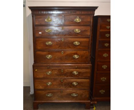A George III mahogany chest on chest, the upper section with stepped dentil cornice above two short and three long drawers br