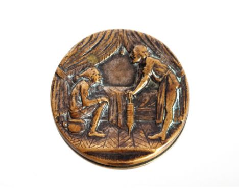 A 19th Century German yellow metal picture button depicting enema treatment, 2.7cm dia.&nbsp;