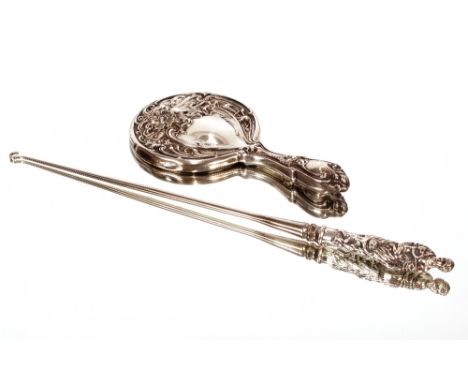 A large Victorian steel button hook, with figural silver handle London 1888, 41cm long; and an Art Nouveau quadruple plated h