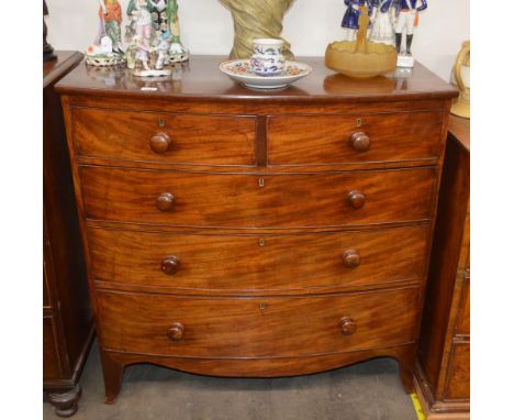 A 19th Century mahogany bow fronted chest, of two short and three long graduated drawers raised on a shaped apron and bracket