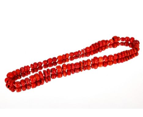 An antique coral bead necklace and pendant; and a jade necklace with 9ct gold clasp
