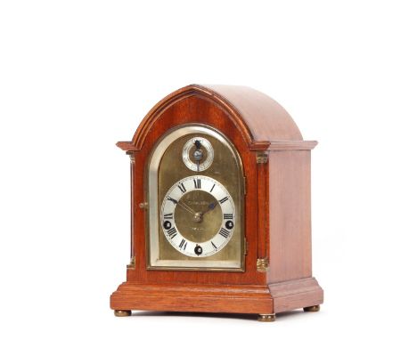 A chiming mantel clock, in mahogany lancet shaped case, the brass and steel dial with Roman numeral chapter ring and chime si