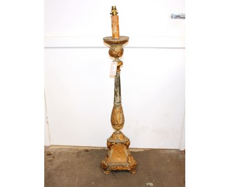 A 19th Century continental Toleware candle stand, converted to a table lamp, having gilt leaf and cherub mask decoration on t