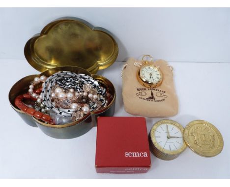 A collection of jewellery and two clocks. Jewellery includes two Bico chains, a gold plated LACAVERA enamel bar brooch, white