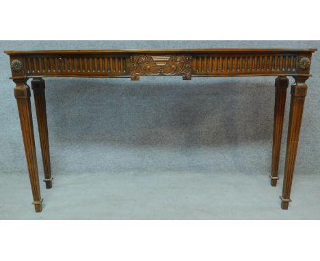 An Adam style mahogany console table on square tapering fluted supports. H.84 W.151 D.45cm 
