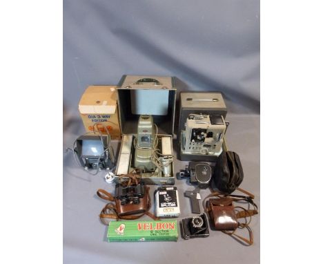 A collection of cameras and cinematic equipment including a Zeiss Ikon camera in leather case, Aldis Aspheric Slide Projector