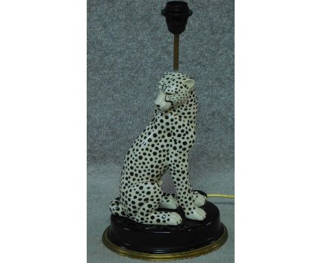A contemporary porcelain cheetah lamp with a brass rim to the base, by House of Hackney. H.50cm 