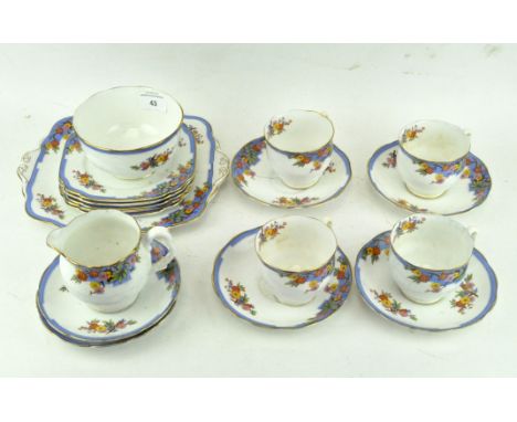 A Lawleys (Regent Street) part tea service, printed black marks, Reg No 749633, printed with flower-sprays within shaped blue