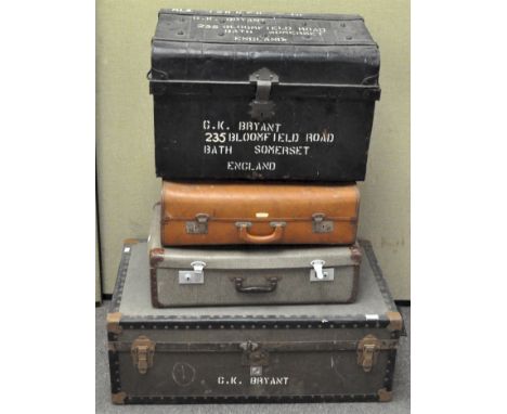 A group of four vintage travelling trunks and a metal riveted trunk, the largest 91 cm x 52.5 cm
