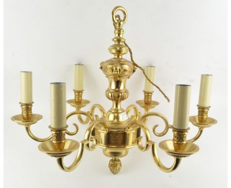A brass six-light chandelier, in the French 18th century style, cast with acanthus scrolls and putti, 52 cm high 