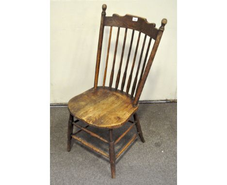 A late 19th/early 20th century Arts and Crafts style Oak stick back chair, 101cm high