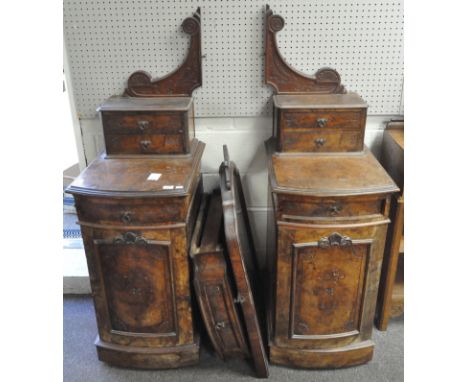 A Victorian walnut dressing table, centred by an arched rectangular mirror and drawer, flanked by double drawers, above a cur