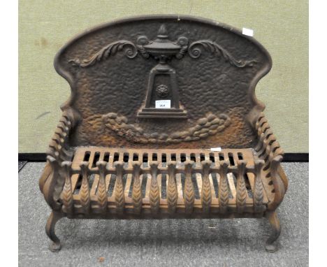 A Victorian cast iron ornate fire grate, the back adorned with urn finial, 47cm x 54cm wide