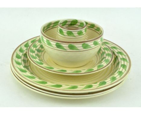 A Clarice Cliff 'Bizarre' part tea-service, circa 1930, printed black marks, painted with bands of green leaves within reeded