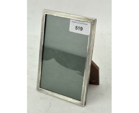A vintage silver mounted photo frame, adorned with engine turned decoration, hallmarked Birmingham 1975 by Sanders &amp; Mack