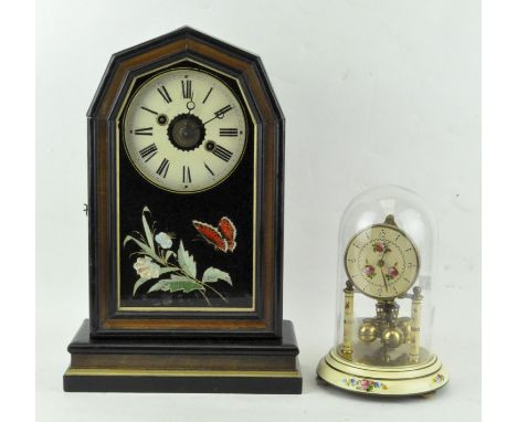 A German mantel clock, the ebonised case adorned with gilt detailing, dial with Roman numerals denoting hours, 37.5cm high, t
