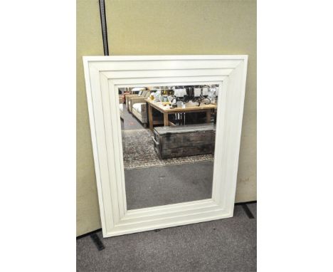 A large bevelled plate mirror with white painted stepped frame, 142cm x 117cm