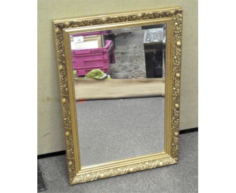 A gilt framed bevelled edged wall mirror, 77cm x 54cm